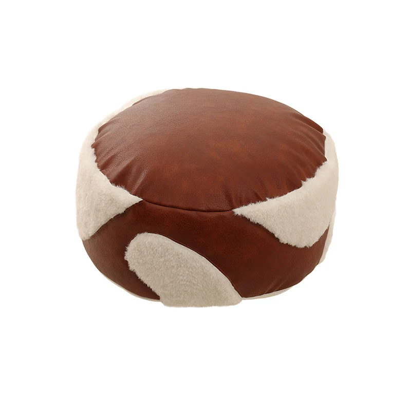 Runde Sitzpouf mit Kunstlederbezug und Sherpa‑Applikationen