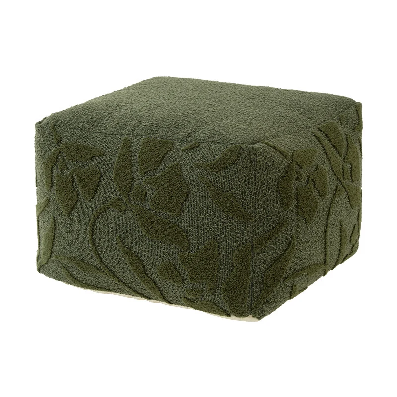 Quadratischer Bodensitzpouf mit strukturierter Bouclé‑Oberfläche und floralem Relief