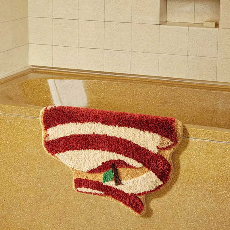 Apfelförmiger Hochflor-Teppich für Bad und Eingangsbereich mit Tuftingstruktur und rutschfester Unterseite